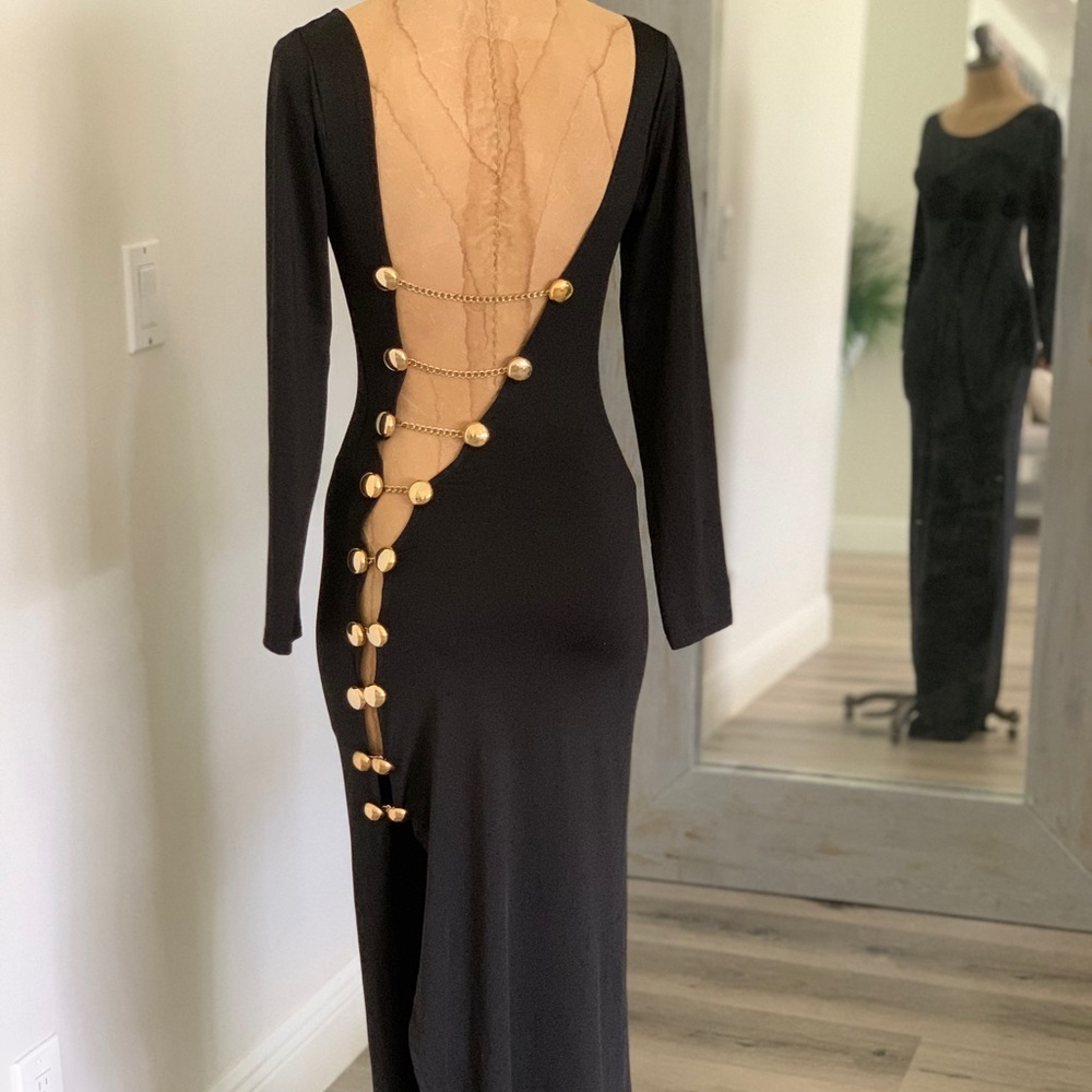 Black gown with open back gold buttons